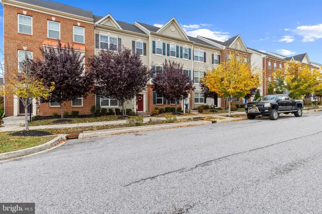 a view of building with cars parked