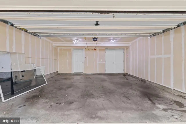 a view of a house with a wooden deck