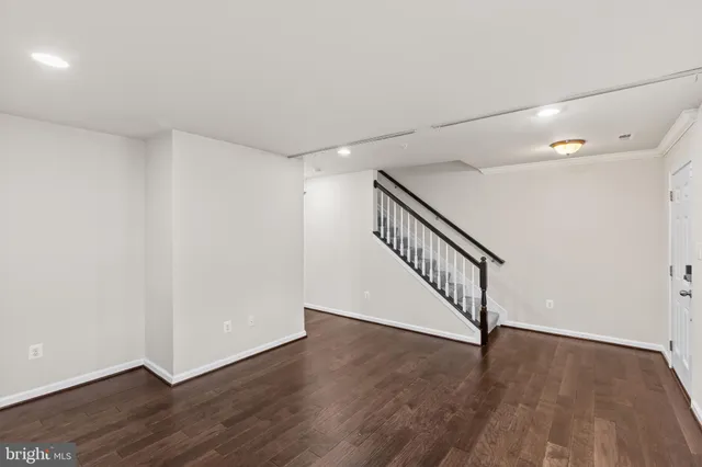 a view of an entryway with wooden floor