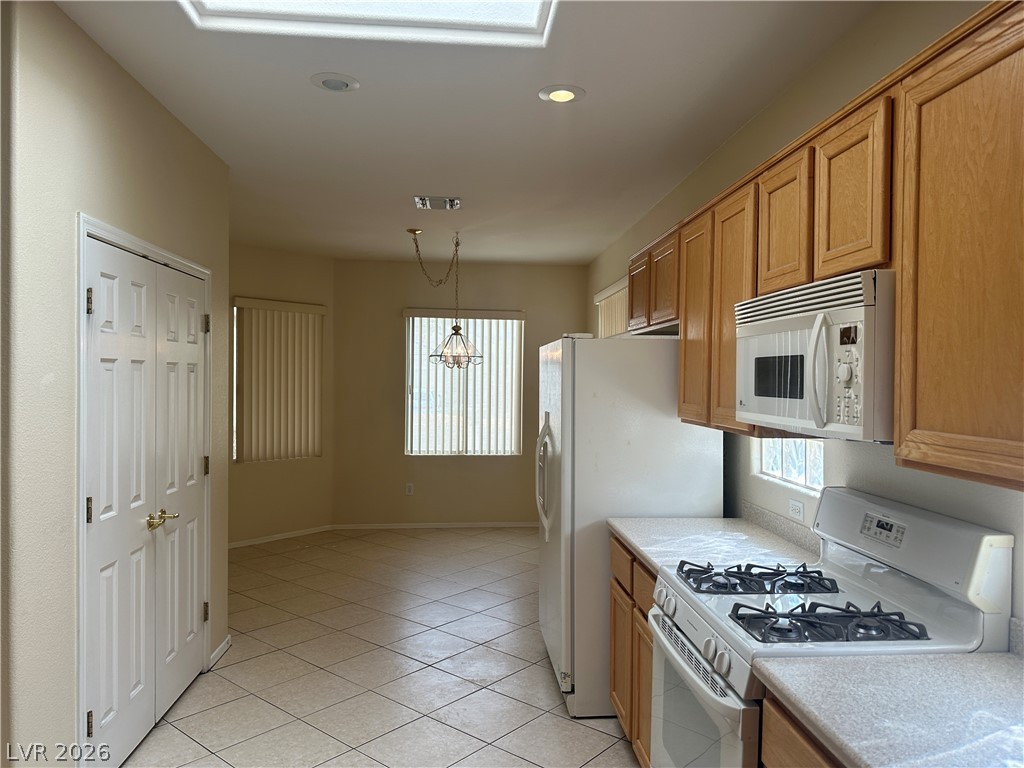 3034 Canal Walk Road Henderson, NV 89052 - Photo 23 of 24 This bright kitchen and dining area provides a seamless transition for daily living.