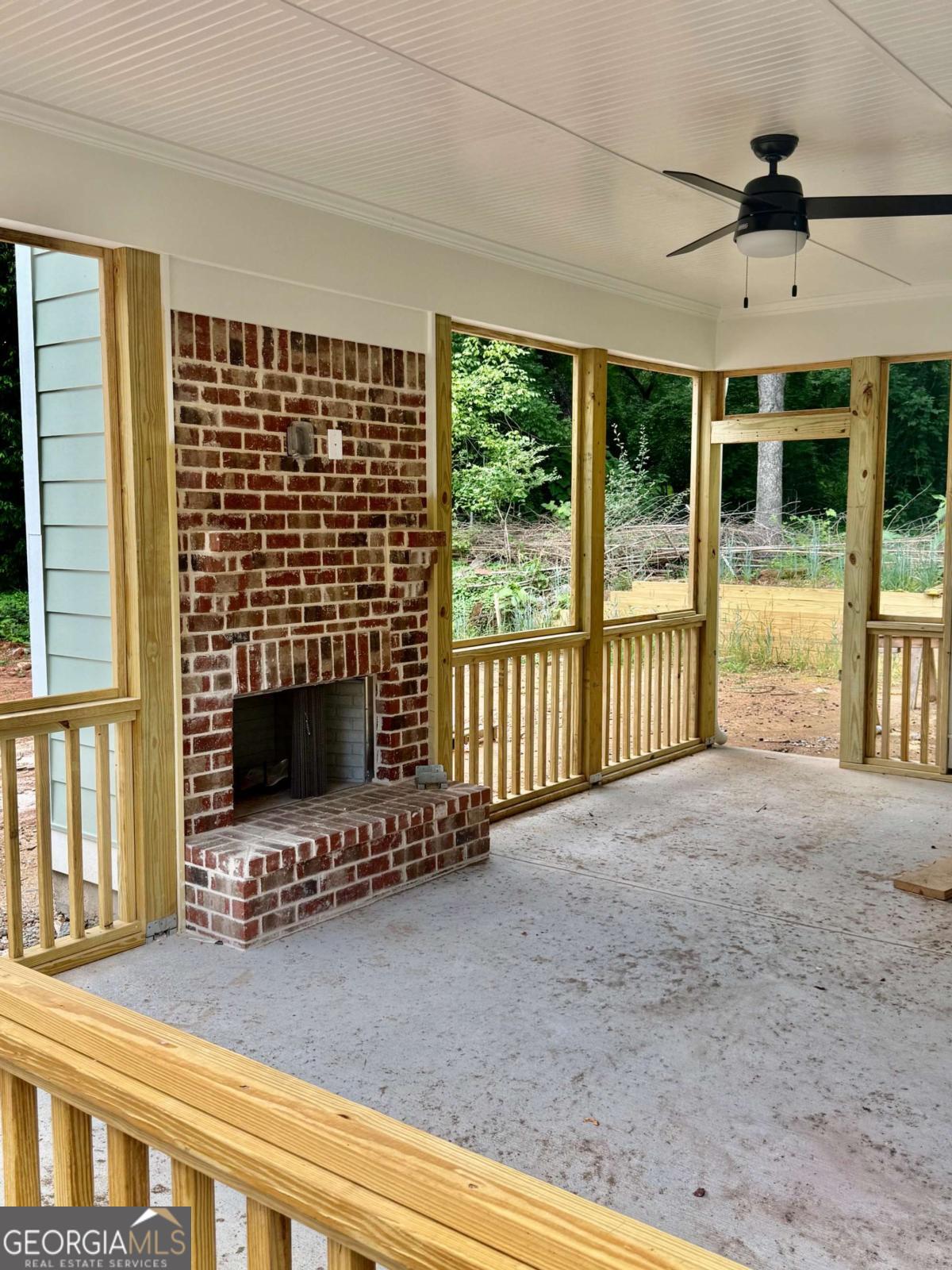 1451 West Broad Street Athens, GA 30601 - Photo 2 of 21 a view of an empty room with a fireplace and a window