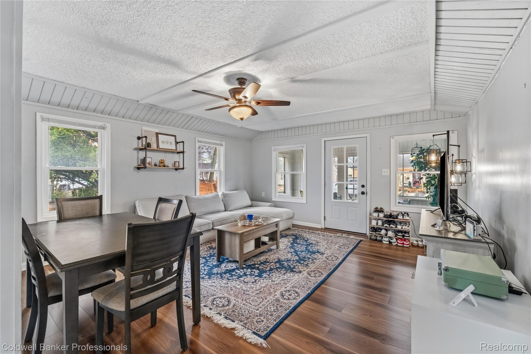 3040 Inman Street Ferndale, MI 48220 - Photo 5 of 41 Living area with a ceiling fan, dark wood-type flooring, healthy amount of natural light, and a textured ceiling