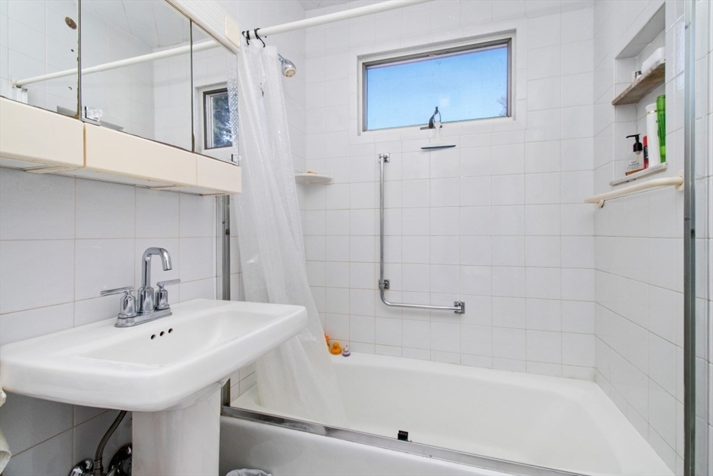 191 Spiers Road Newton, MA 02459 - Photo 12 of 13 a bathroom with a bathtub and a sink