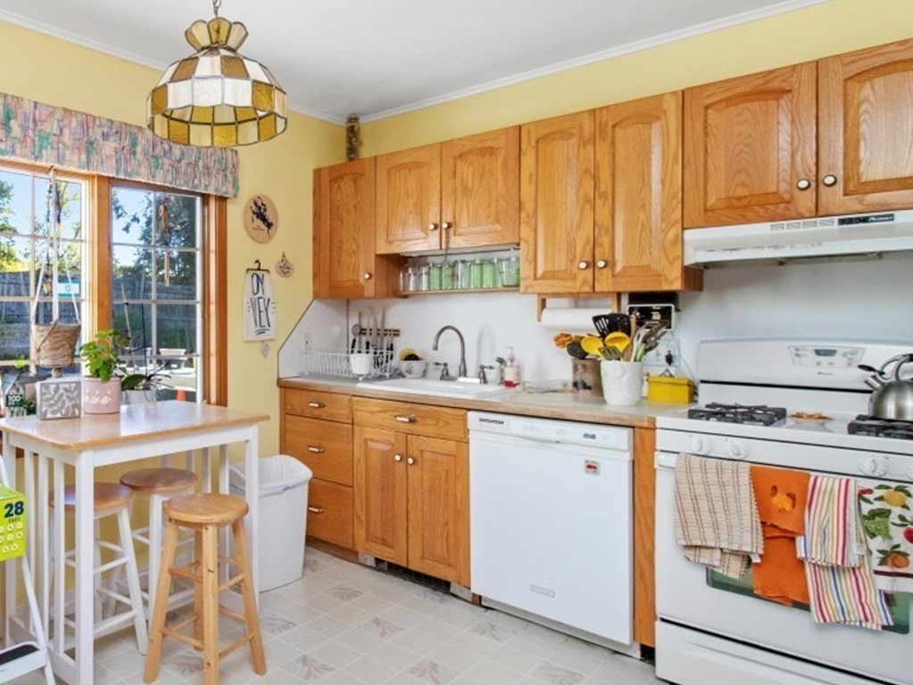 191 Spiers Road Newton, MA 02459 - Photo 7 of 13 a kitchen with stainless steel appliances granite countertop a stove a sink dishwasher and cabinets with wooden floor