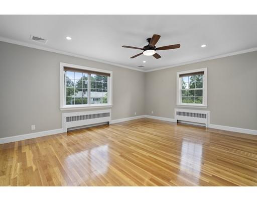 66 Broken Tree Road Newton, MA 02459 - Photo 13 of 26 a view of an empty room with a window and wooden floor