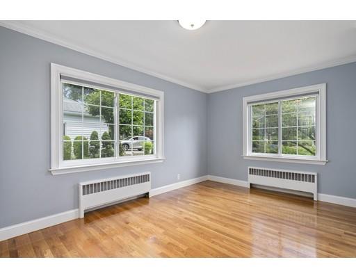 66 Broken Tree Road Newton, MA 02459 - Photo 15 of 26 a view of an empty room with wooden floor and a window