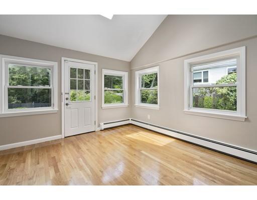 66 Broken Tree Road Newton, MA 02459 - Photo 16 of 26 an empty room with wooden floor and windows