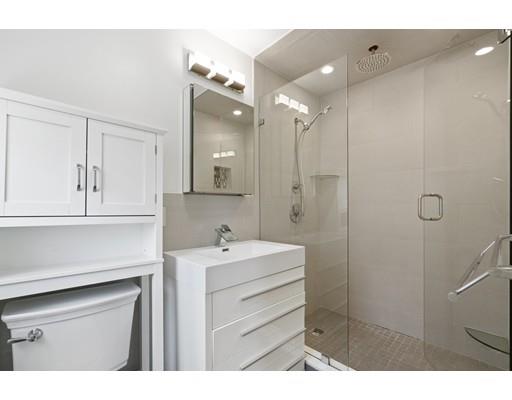 66 Broken Tree Road Newton, MA 02459 - Photo 23 of 26 a bathroom with a sink double vanity and a shower