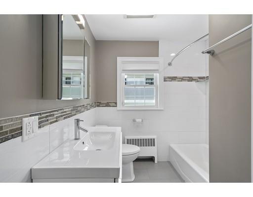 66 Broken Tree Road Newton, MA 02459 - Photo 24 of 26 a bathroom with a sink mirror and a bathtub