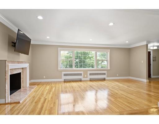 66 Broken Tree Road Newton, MA 02459 - Photo 6 of 26 a view of an empty room with wooden floor and a window