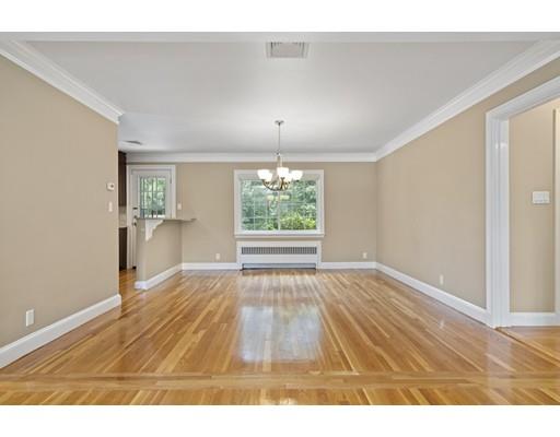 66 Broken Tree Road Newton, MA 02459 - Photo 8 of 26 a view of an empty room with wooden floor and a window