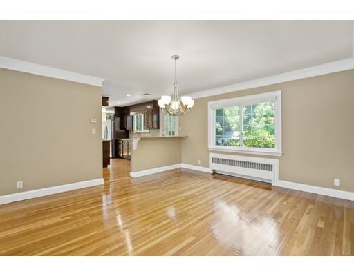 66 Broken Tree Road Newton, MA 02459 - Photo 9 of 26 a view of empty room with wooden floor and fireplace