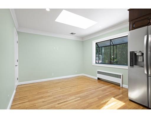 66 Broken Tree Road Newton, MA 02459 - Photo 10 of 26 a view of an empty room with wooden floor and a window
