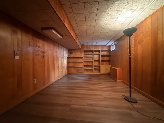 a view of a room with wooden walls