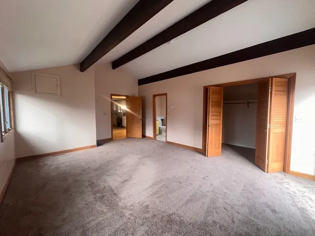 a view of empty room with windows