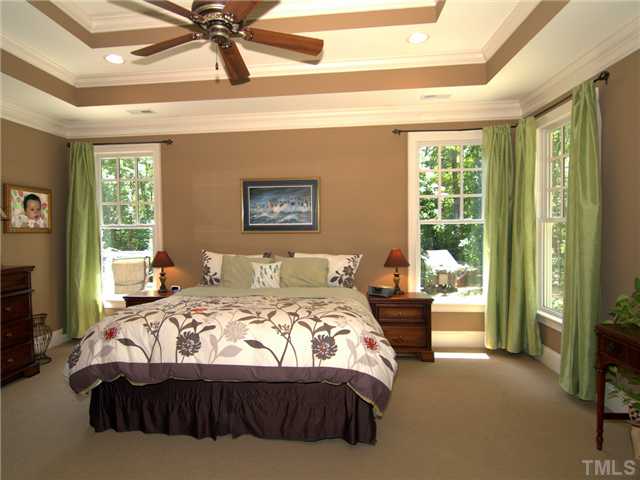 96 Avalant Pittsboro, NC 27312 - Photo 11 of 25 a bedroom with a bed and glass window