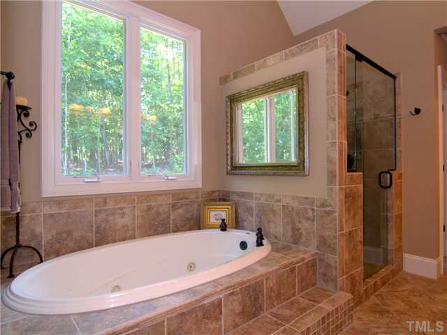 96 Avalant Pittsboro, NC 27312 - Photo 13 of 25 a bathroom with a tub and a window