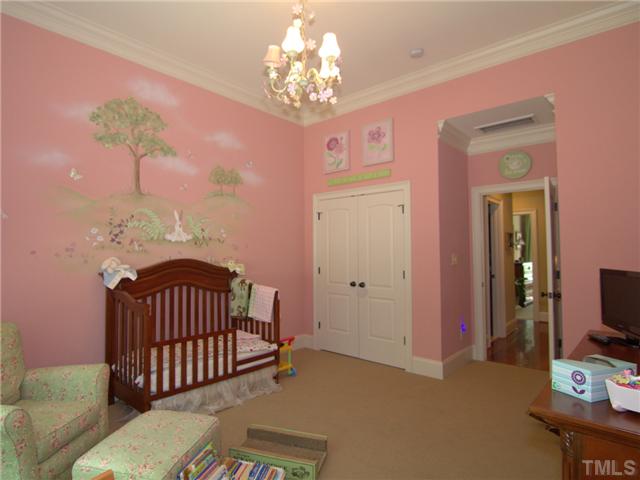 96 Avalant Pittsboro, NC 27312 - Photo 15 of 25 a bedroom with furniture and a chandelier