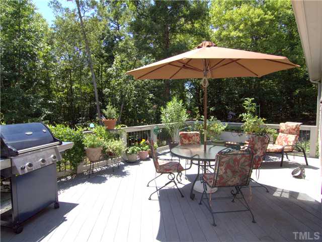 96 Avalant Pittsboro, NC 27312 - Photo 20 of 25 a view of backyard with outdoor seating and trees