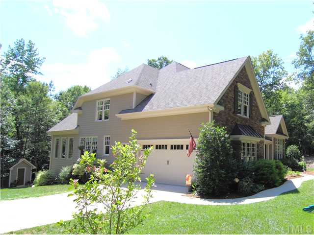 96 Avalant Pittsboro, NC 27312 - Photo 22 of 25 a front view of a house with garden