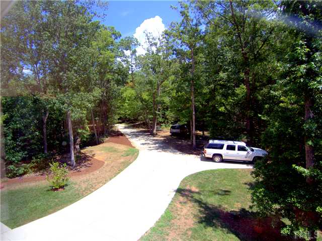 96 Avalant Pittsboro, NC 27312 - Photo 23 of 25 a view of a backyard with a garden and seating area