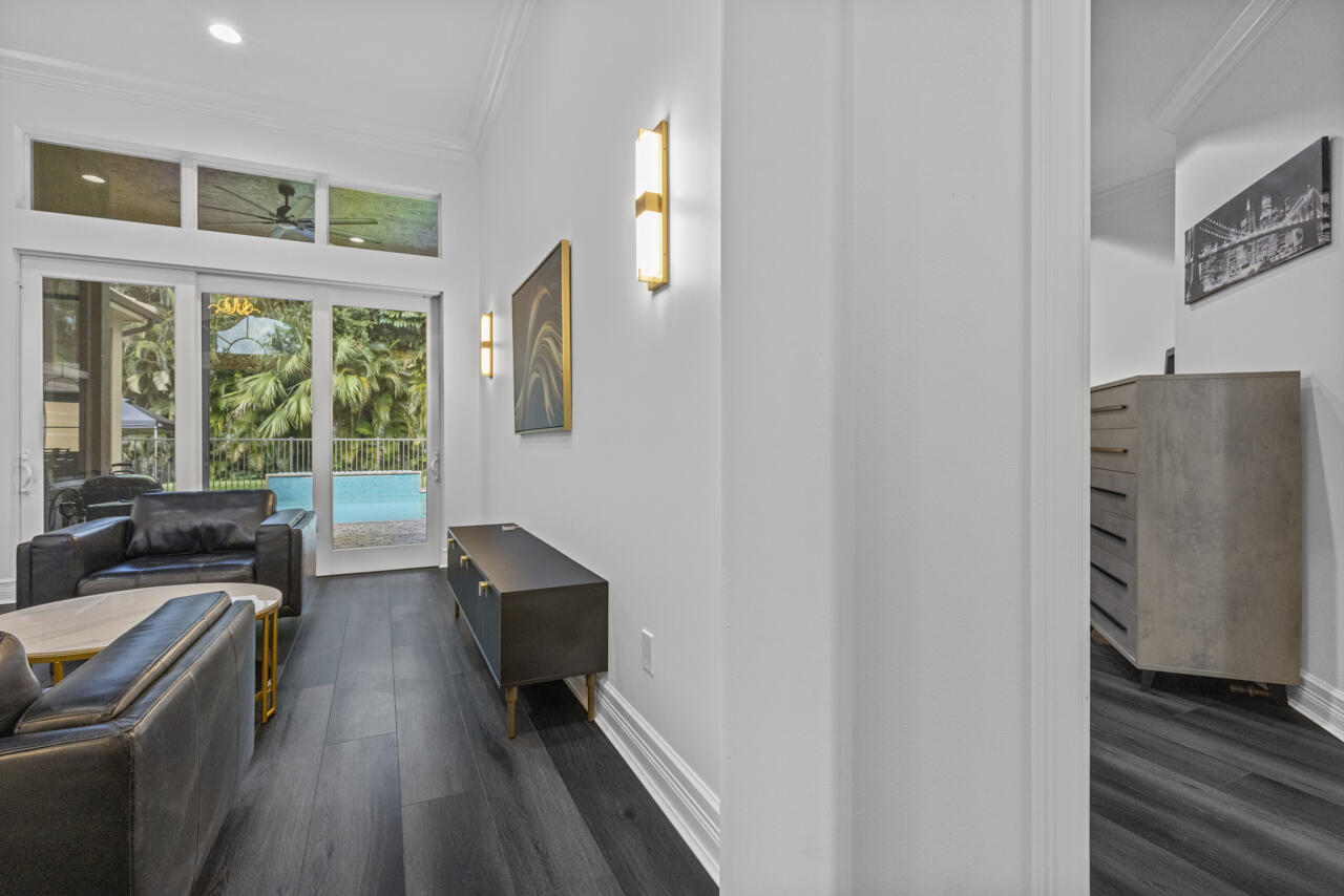 8300 Southwest Cattleya Drive Stuart, FL 34997 - Photo 16 of 77 a view of a livingroom with furniture wooden floor and window