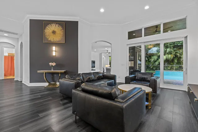 a kitchen with stainless steel appliances granite countertop a refrigerator a stove top oven a sink and dishwasher