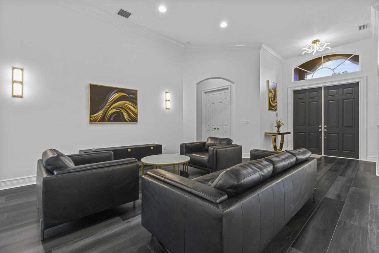 8300 Southwest Cattleya Drive Stuart, FL 34997 - Photo 19 of 77 a living room with furniture