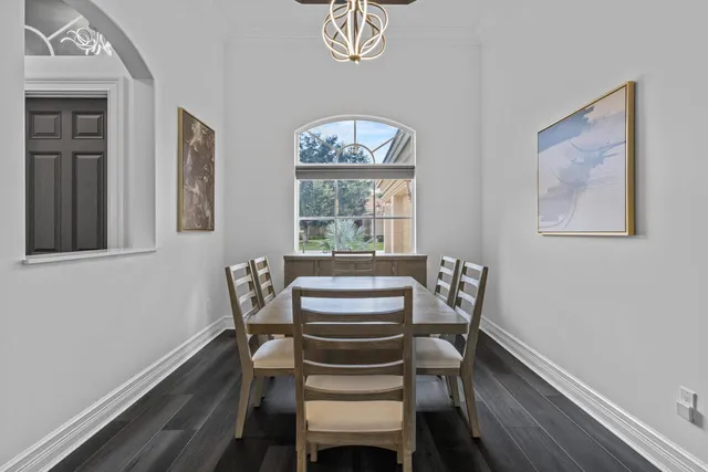 a bathroom with a sink a toilet a mirror and shower curtain