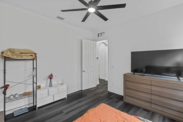 a living room with furniture chess board and a fireplace