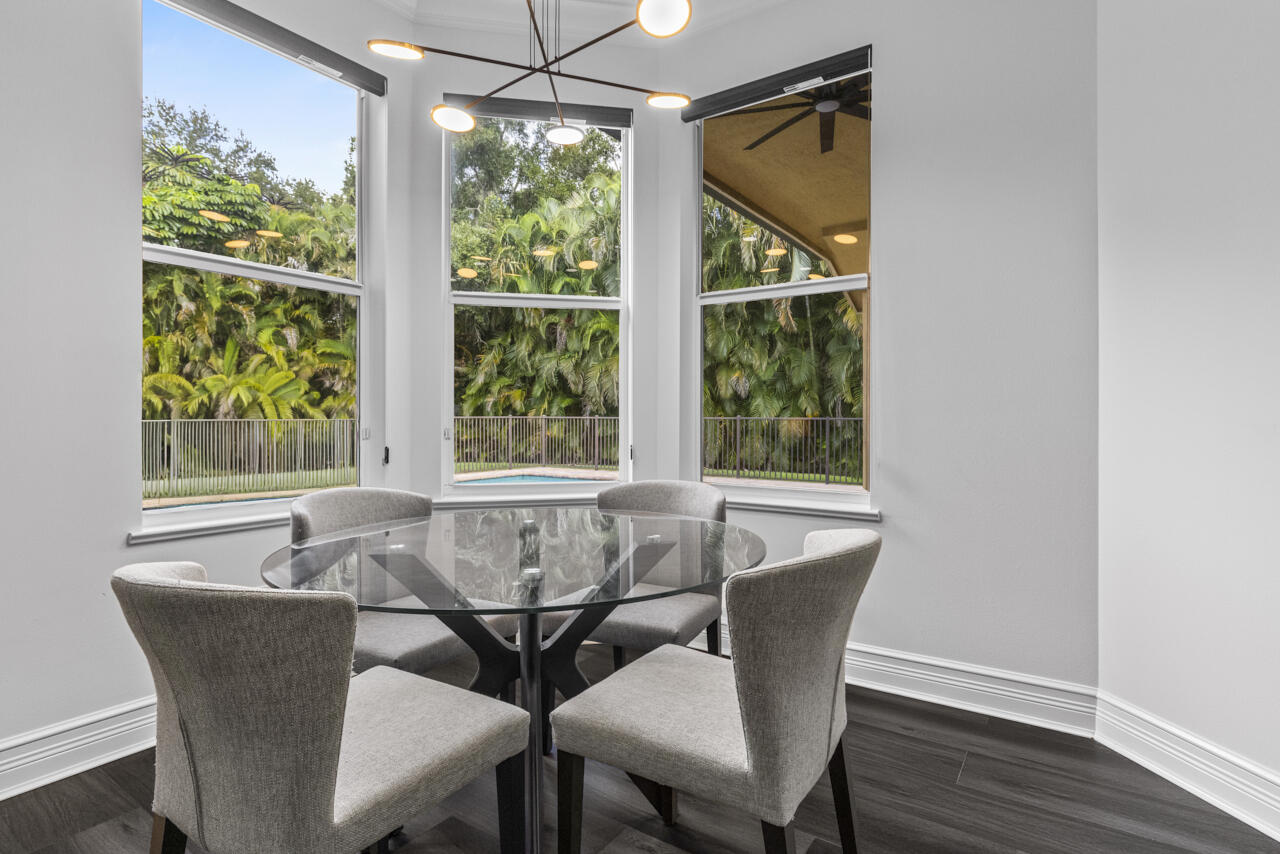 8300 Southwest Cattleya Drive Stuart, FL 34997 - Photo 38 of 77 a view of a dining room with furniture window and outside view