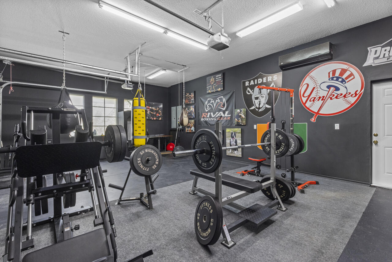 8300 Southwest Cattleya Drive Stuart, FL 34997 - Photo 50 of 77 a view of a room with gym equipment