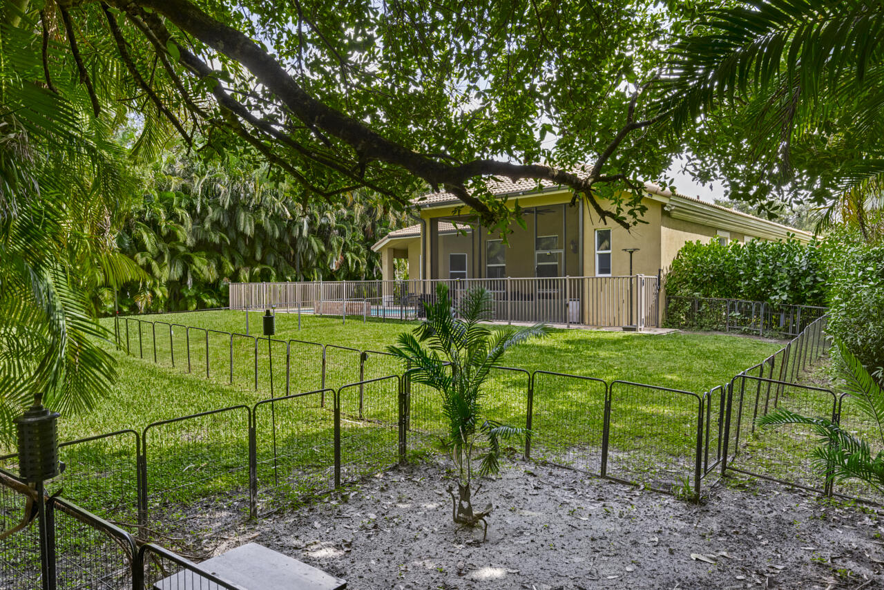 8300 Southwest Cattleya Drive Stuart, FL 34997 - Photo 57 of 77 a view of a house with backyard