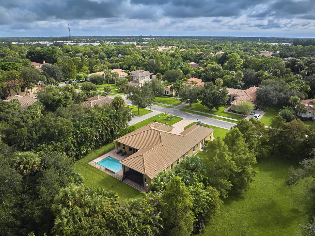 8300 Southwest Cattleya Drive Stuart, FL 34997 - Photo 63 of 77 an aerial view of residential house with outdoor space and swimming pool