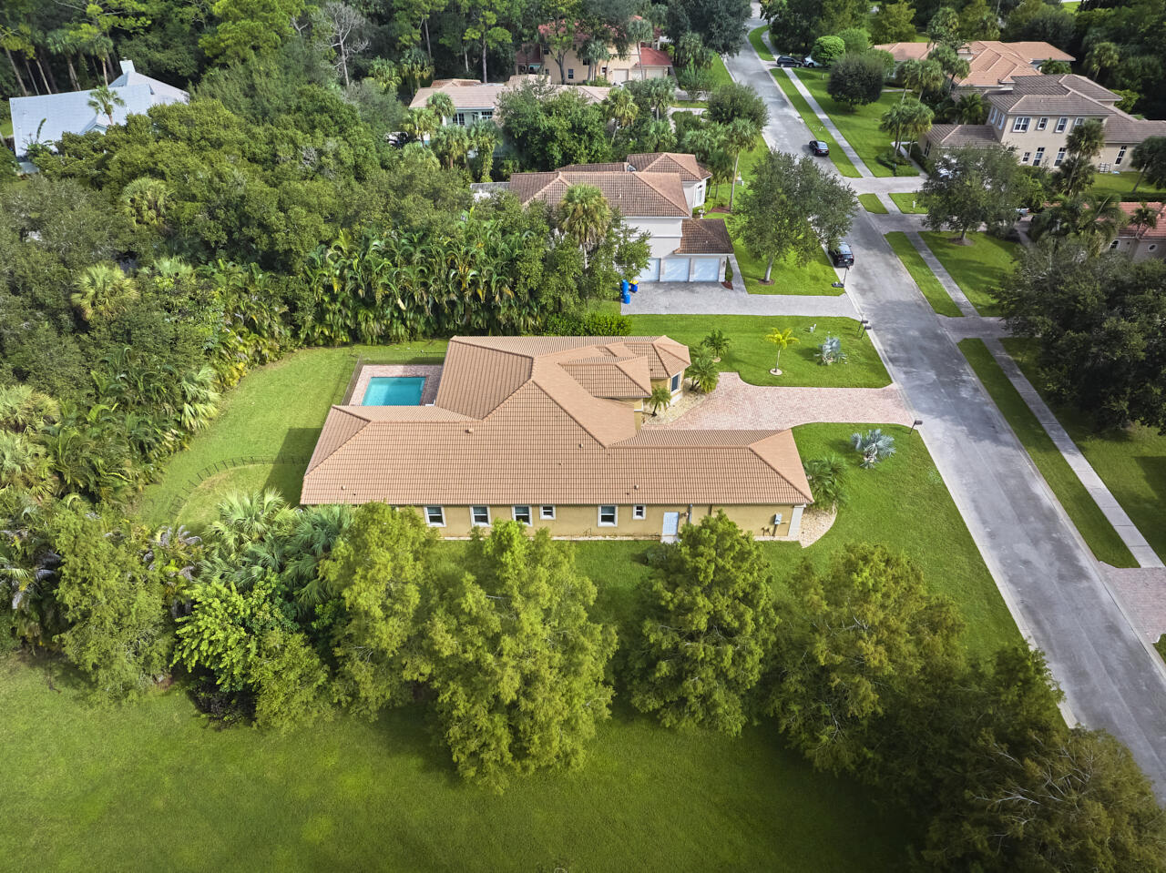 8300 Southwest Cattleya Drive Stuart, FL 34997 - Photo 64 of 77 an aerial view of a house with a yard