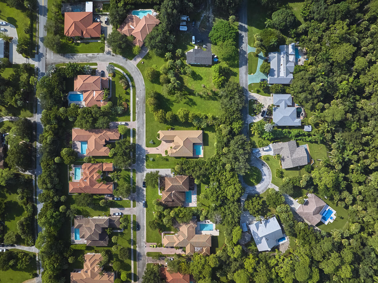 8300 Southwest Cattleya Drive Stuart, FL 34997 - Photo 68 of 77 an aerial view of residential houses with outdoor space and street view
