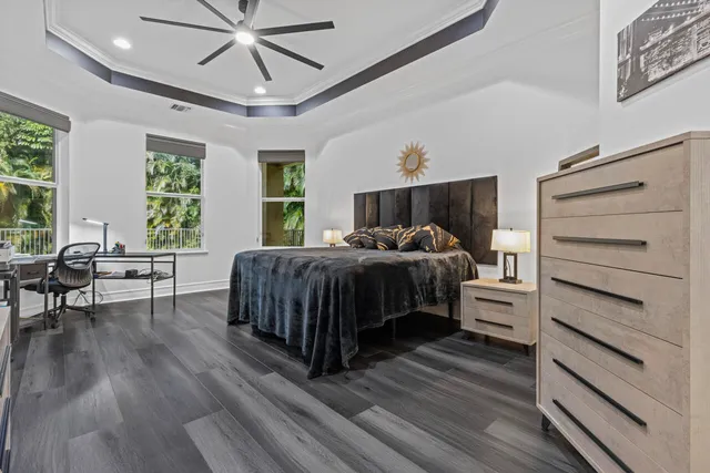 a bedroom with a bed and a night stand