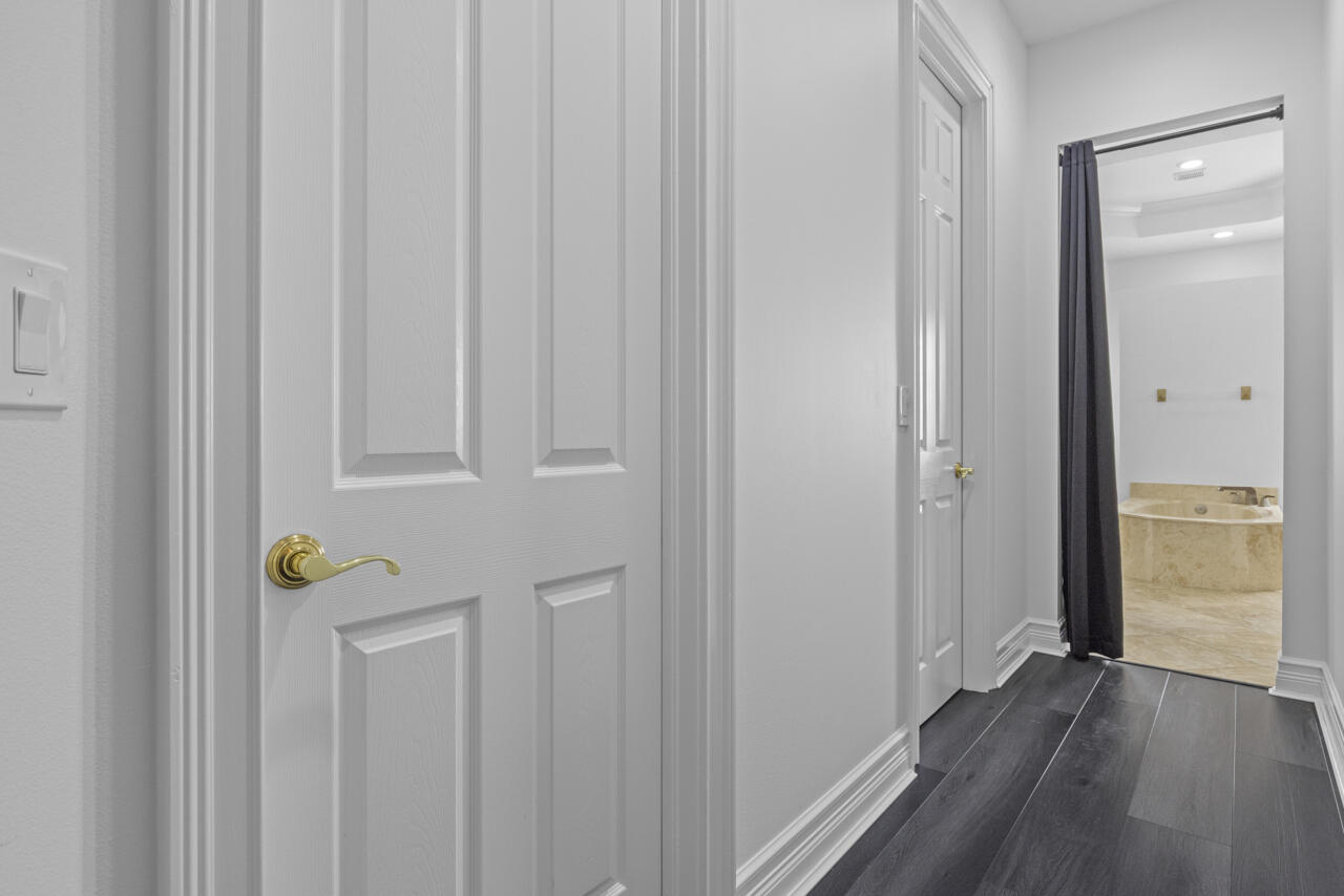8300 Southwest Cattleya Drive Stuart, FL 34997 - Photo 9 of 77 a view of hallway with wooden floor