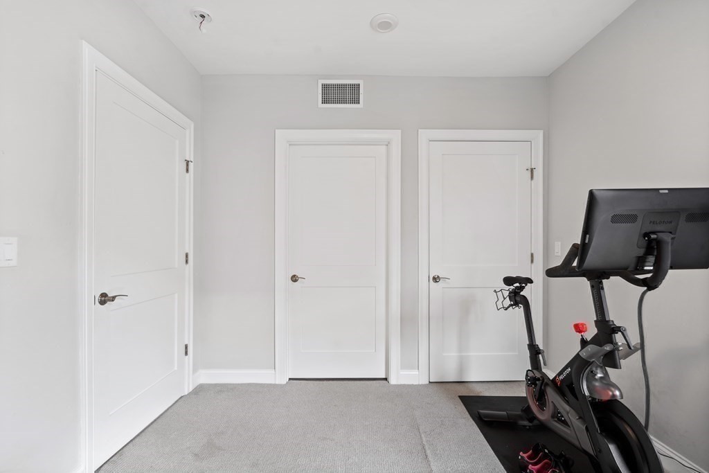 771 Harrison Avenue, Unit 207 Boston, MA 02118 - Photo 15 of 28 a view of a room with gym equipment