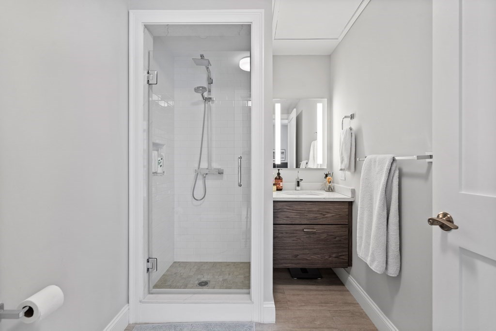 771 Harrison Avenue, Unit 207 Boston, MA 02118 - Photo 17 of 28 a bathroom with a shower and a sink