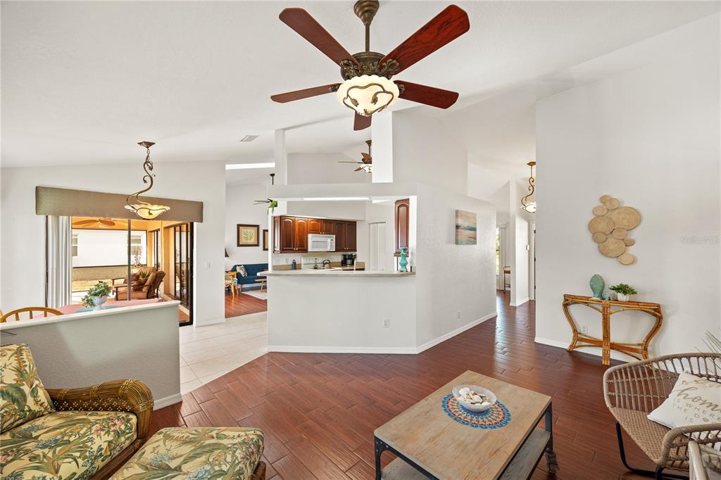 26223 Barcelos Court Punta Gorda, FL 33983 - Photo 11 of 34 a living room with furniture and a wooden floor