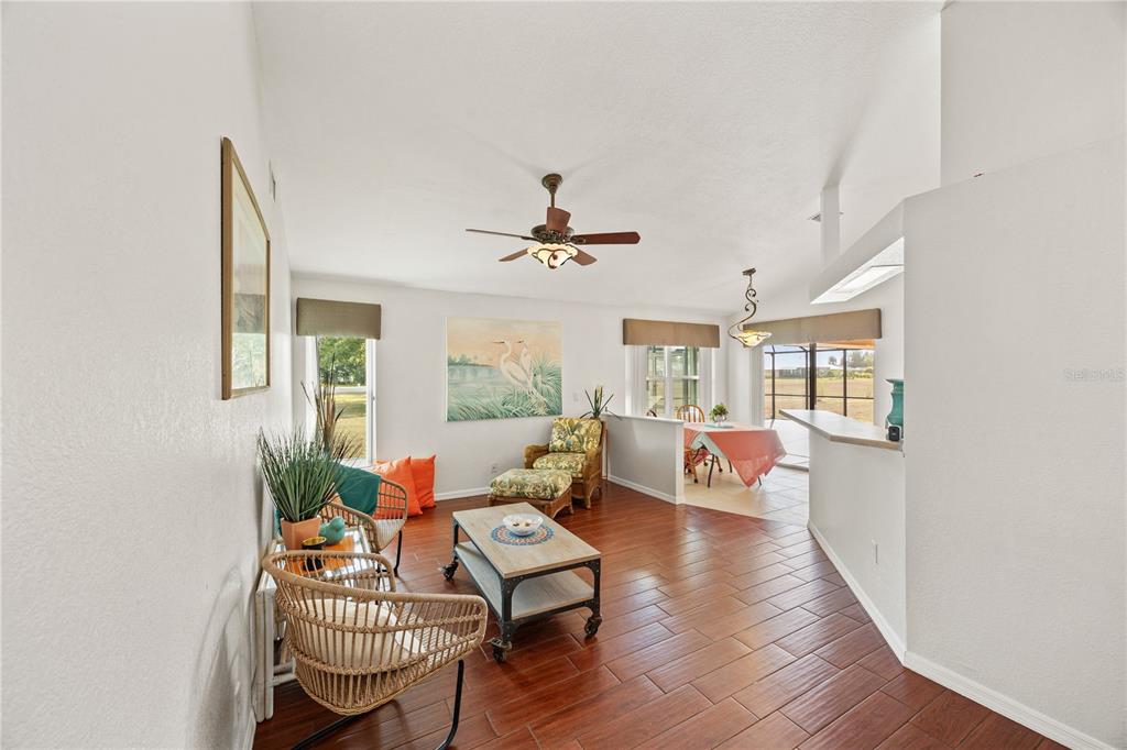 26223 Barcelos Court Punta Gorda, FL 33983 - Photo 12 of 34 a living room with furniture and wooden floor