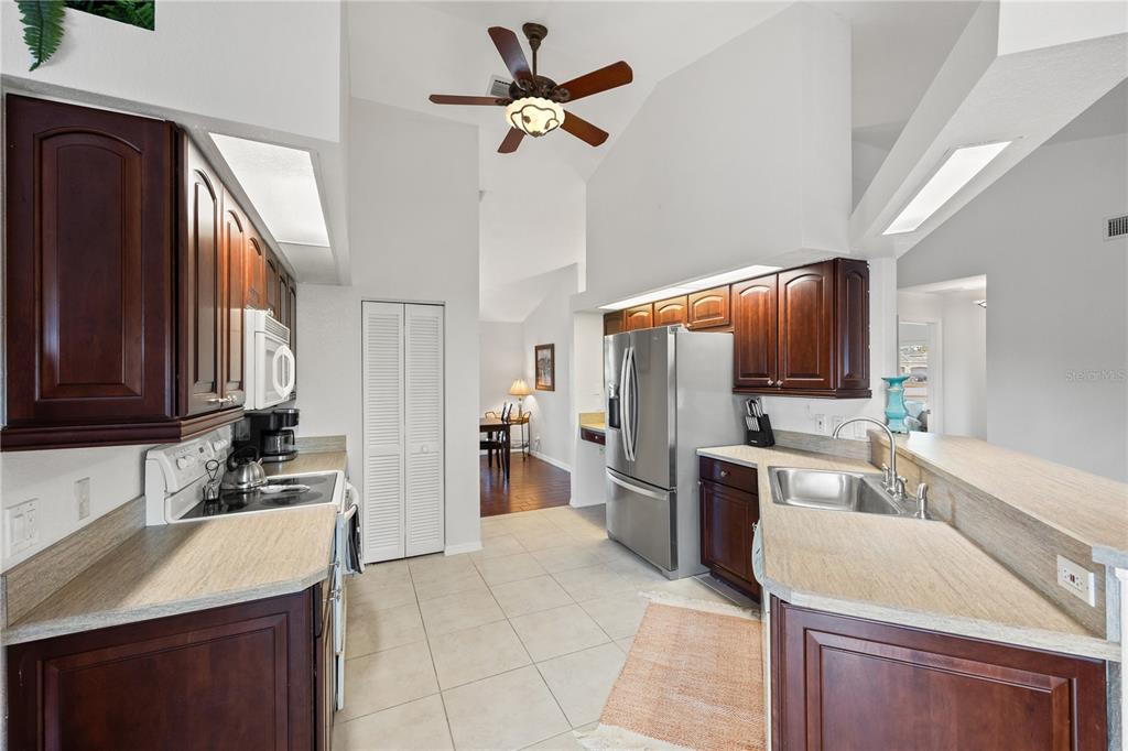 26223 Barcelos Court Punta Gorda, FL 33983 - Photo 13 of 34 a kitchen with a sink appliances and cabinets