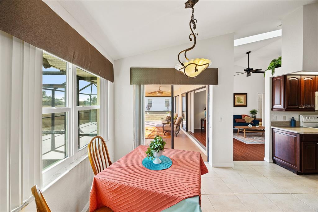 26223 Barcelos Court Punta Gorda, FL 33983 - Photo 16 of 34 a view of a dining room with furniture a livingroom and chandelier