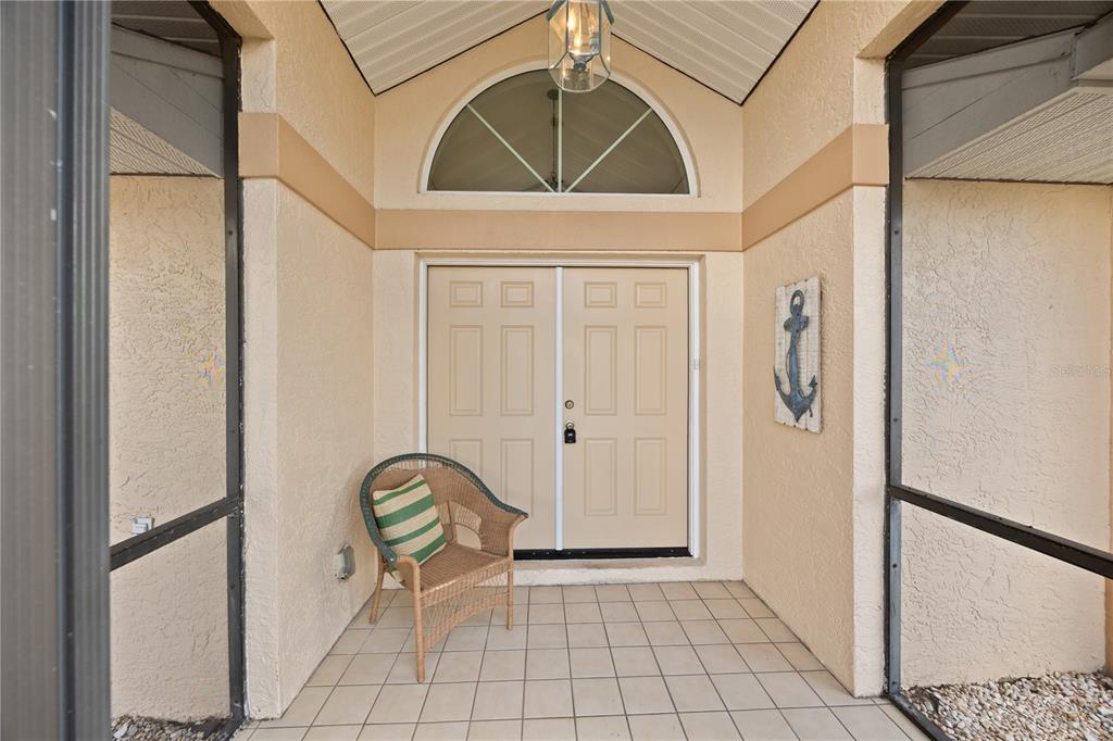 26223 Barcelos Court Punta Gorda, FL 33983 - Photo 2 of 34 a view of an entryway with wooden floor