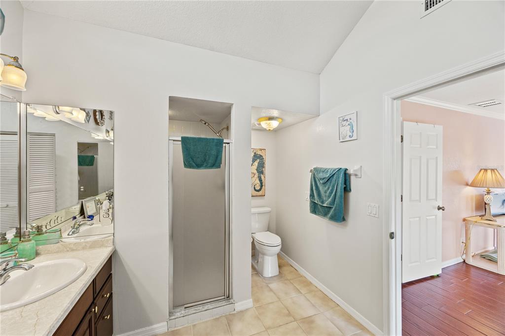 26223 Barcelos Court Punta Gorda, FL 33983 - Photo 21 of 34 a bathroom with a sink toilet and shower