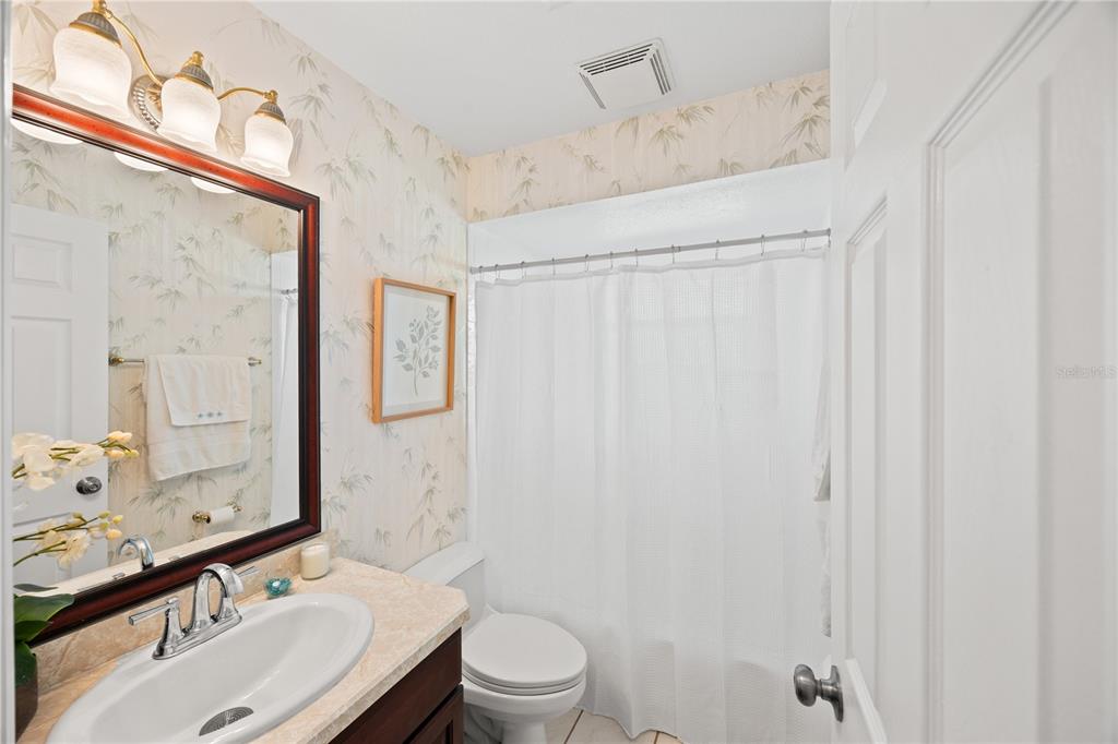 26223 Barcelos Court Punta Gorda, FL 33983 - Photo 25 of 34 a bathroom with a sink toilet and shower