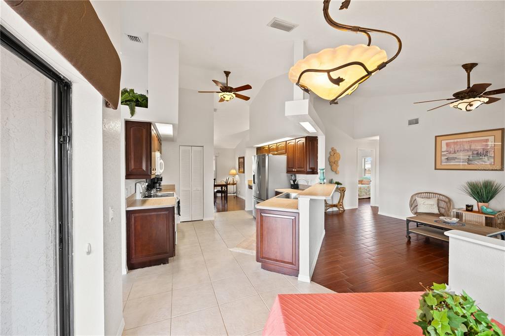 26223 Barcelos Court Punta Gorda, FL 33983 - Photo 3 of 34 a living room with stainless steel appliances kitchen island granite countertop furniture