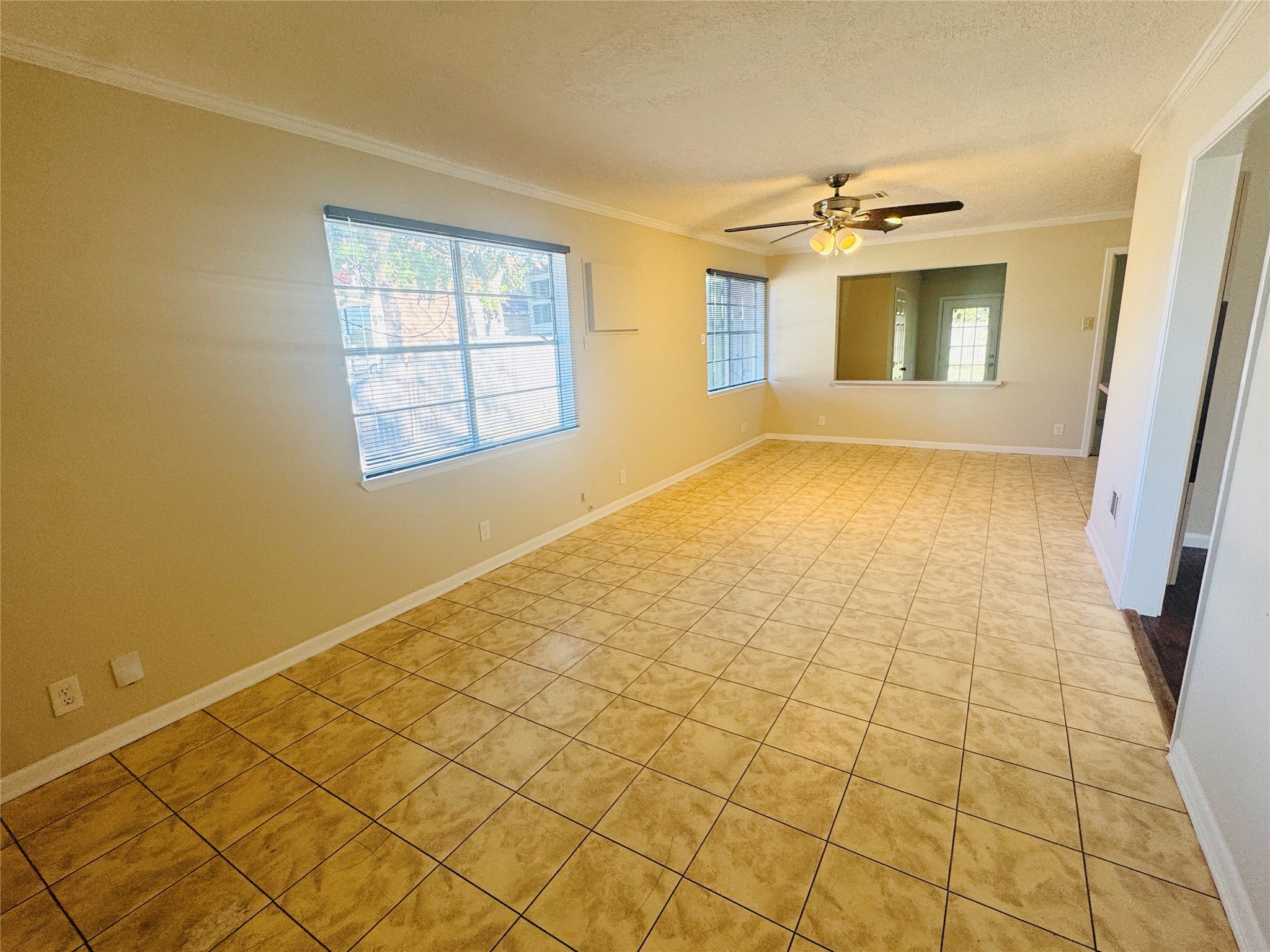 605 Tovrea Road Alvin, TX 77511 - Photo 12 of 18 a view of an empty room and window