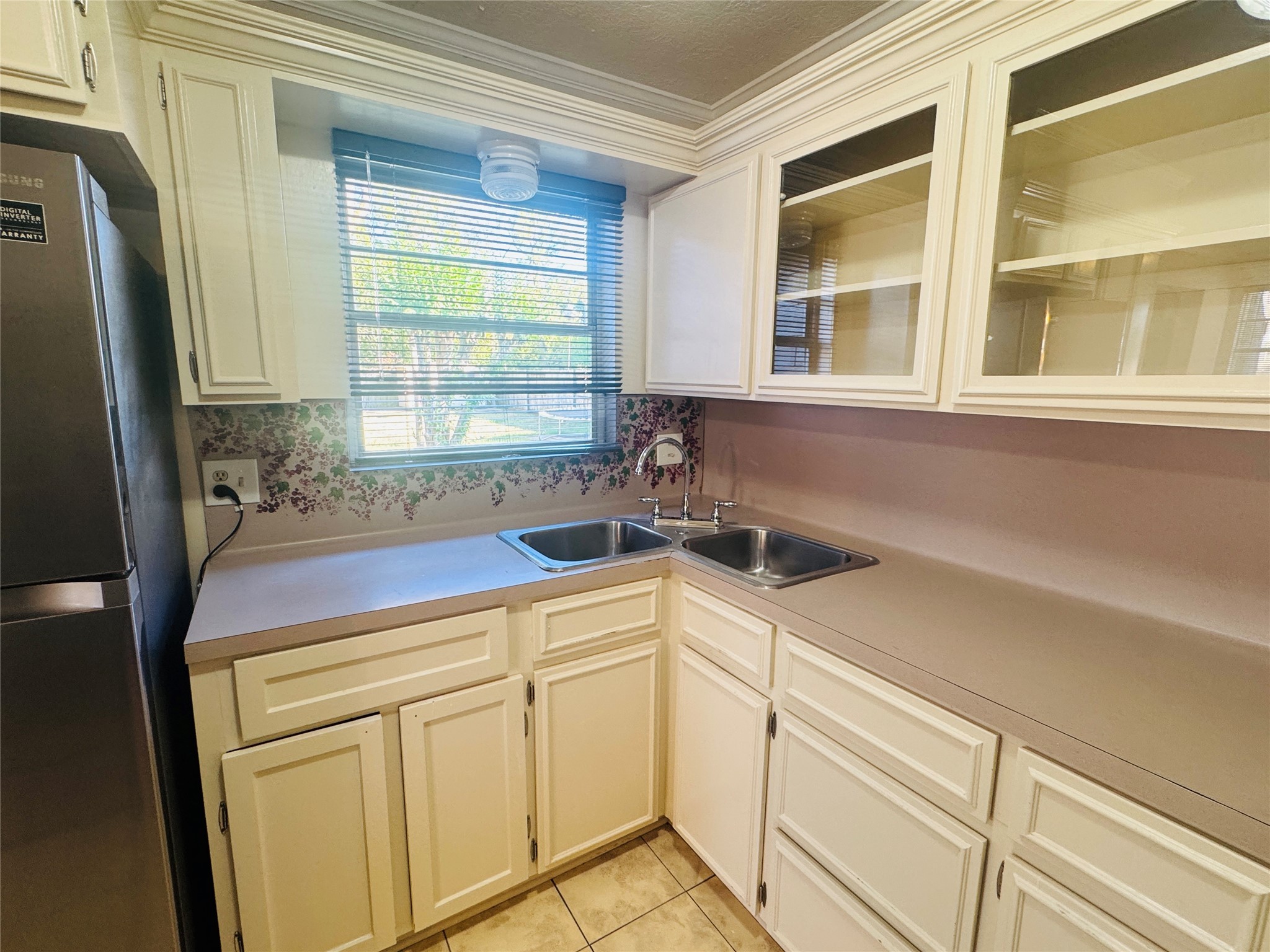 605 Tovrea Road Alvin, TX 77511 - Photo 14 of 18 a view of a kitchen sink and a window